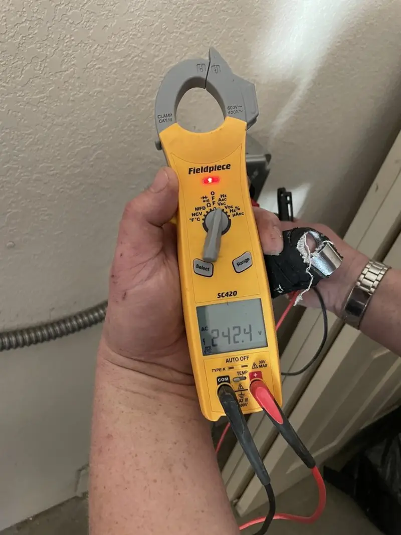 Voltage testing with clamp meter during Whole House Surge Protector in Phenix City